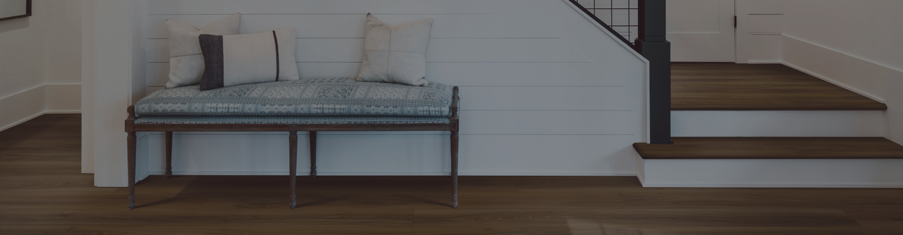 light natural wide plank hardwood flooring in living area with chaise lounge and fireplace