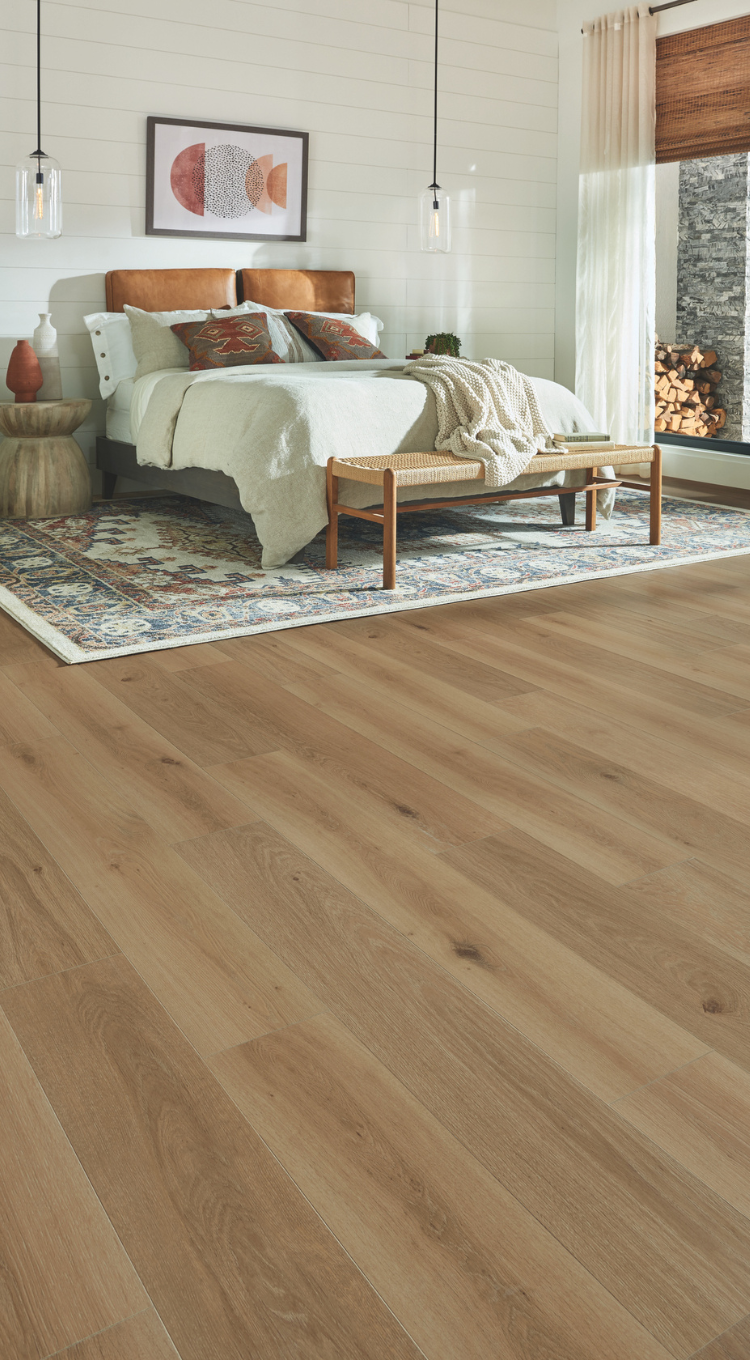 area rug in a bedroom over laminate floors